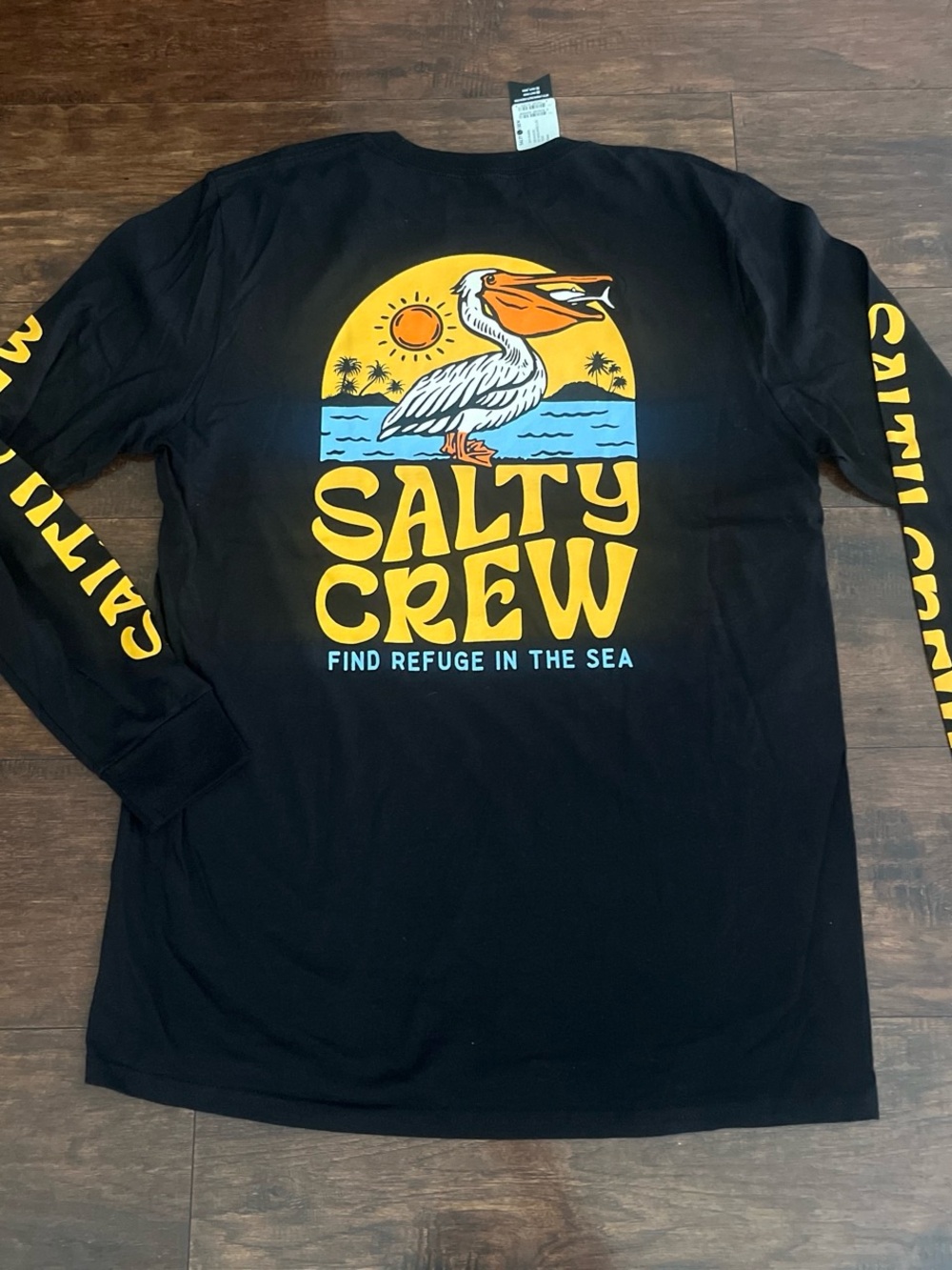 Salty Crew Black Long Sleeve Swim Tee with Yellow & Blue Pelican Graphic